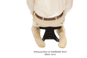 Sitting in kneeling position (back view) while using SalatBuddy Contemporary Prayer and Poster Stool